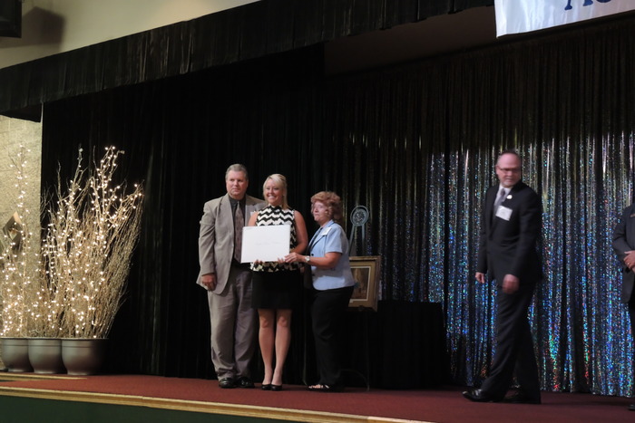 Judy and Doug Peckens present Wall License to Breeci