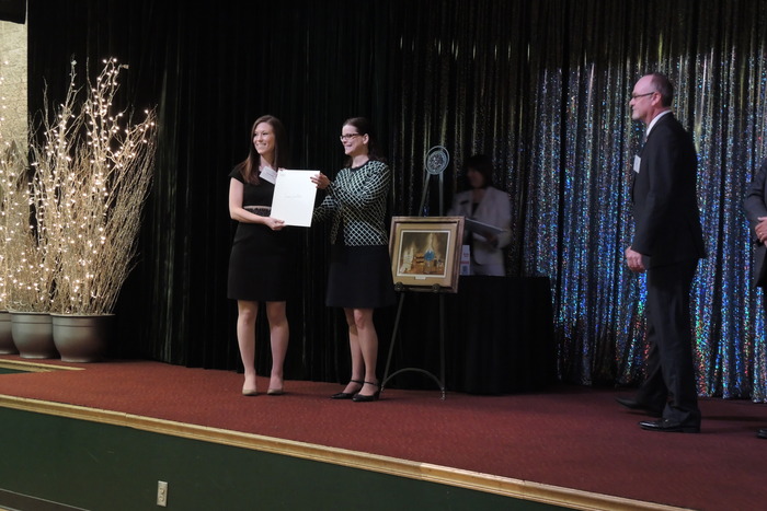 Dee Dee Myers presents Wall License to Cortney Mospan