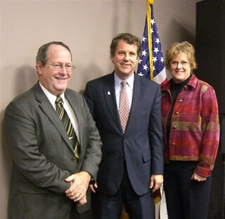 OPA Executive Director Ernest Boyd (left) and pharmacist wife Twila thank Senator Sherrod Brown for his sponsorship of the “tamper-resistant” legislation.